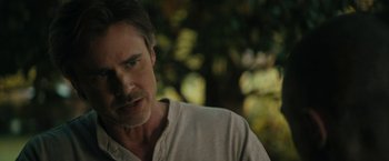 Movie still from “Imperium” (2016), directed by Daniel Ragussis – A person wearing a shirt; Close Up shot, Over the shoulder angle