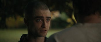Movie still from “Imperium” (2016), directed by Daniel Ragussis – A person with a shaved head; Close Up shot, Over the shoulder angle