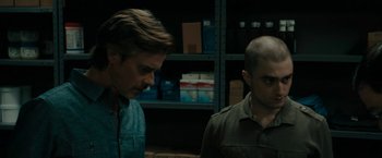 Movie still from “Imperium” (2016), directed by Daniel Ragussis – Two men standing next to each other in a room; Close Up shot, Over the shoulder angle