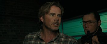Movie still from “Imperium” (2016), directed by Daniel Ragussis – A person wearing a plaid shirt; Close Up shot, Over the shoulder angle