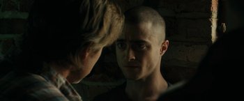 Movie still from “Imperium” (2016), directed by Daniel Ragussis – A man with a shaved head looking into a mirror; Close Up shot, Over the shoulder angle