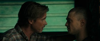 Movie still from “Imperium” (2016), directed by Daniel Ragussis – A man and a woman face to face in front of a green wall; Close Up shot, Over the shoulder angle