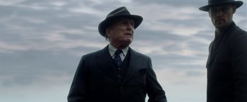 Movie still from “In Dubious Battle” (2016), directed by James Franco – An older man in a suit and hat looking off into the distance; Close Up shot, Low angle