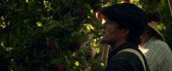 Movie still from “In Dubious Battle” (2016), directed by James Franco – A man standing next to an apple tree; Close Up shot, Low angle