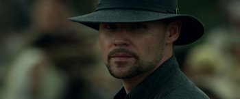 Movie still from “In Dubious Battle” (2016), directed by James Franco – A person wearing a hat; Close Up shot, Low angle