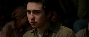 Movie still from “In Dubious Battle” (2016), directed by James Franco – A young man is looking into the distance; Close Up shot, Over the shoulder angle