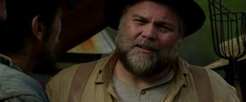 Movie still from “In Dubious Battle” (2016), directed by James Franco – A person with a beard wearing a hat; Close Up shot, Low angle