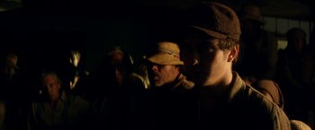 Movie still from “In Dubious Battle” (2016), directed by James Franco – A group of people standing next to each other in the dark; Close Up shot, Low angle