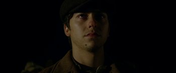 Movie still from “In Dubious Battle” (2016), directed by James Franco – A man wearing a hat looking up at the sky; Close Up shot, Low angle