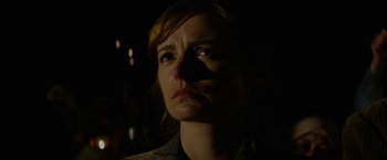 Movie still from “In Dubious Battle” (2016), directed by James Franco – A person looking up at the sky; Close Up shot, Over the shoulder angle