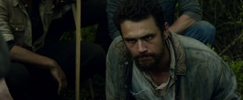 Movie still from “In Dubious Battle” (2016), directed by James Franco – A person wearing a jean jacket; Close Up shot, High angle