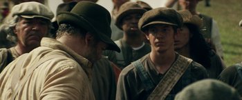 Movie still from “In Dubious Battle” (2016), directed by James Franco – A group of men standing next to each other; Close Up shot, Over the shoulder angle