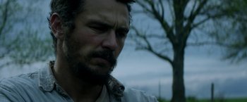 Movie still from “In Dubious Battle” (2016), directed by James Franco – A person wearing a neck tie; Close Up shot, Low angle