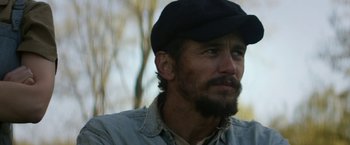 Movie still from “In Dubious Battle” (2016), directed by James Franco – A person wearing a hat; Close Up shot, Over the shoulder angle