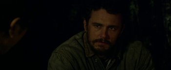 Movie still from “In Dubious Battle” (2016), directed by James Franco – A person with a beard; Close Up shot, Over the shoulder angle