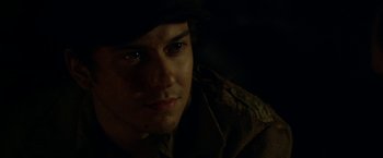 Movie still from “In Dubious Battle” (2016), directed by James Franco – A young man wearing a hat and a jacket; Close Up shot, Over the shoulder angle