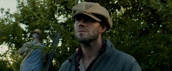 Movie still from “In Dubious Battle” (2016), directed by James Franco – A person wearing a hat; Close Up shot, Low angle