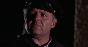 Movie still from “In the Heat of the Night” (1967), directed by Norman Jewison – A person wearing a hat; Close Up shot, Low angle