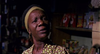 Movie still from “In the Heat of the Night” (1967), directed by Norman Jewison – An older woman wearing a yellow and black dress; Close Up shot, Low angle