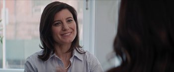 Movie still from “In the Heights” (2021), directed by Jon M. Chu – A person wearing a shirt; Close Up shot, Over the shoulder angle