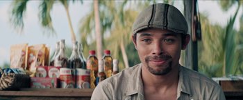 Movie still from “In the Heights” (2021), directed by Jon M. Chu – A person wearing a hat; Close Up shot, Over the shoulder angle