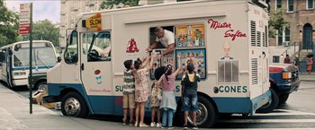 Movie still from “In the Heights” (2021), directed by Jon M. Chu – A group of kids getting ice cream from a truck; Extreme Wide shot, Low angle