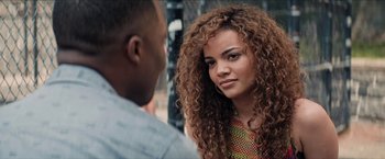 Movie still from “In the Heights” (2021), directed by Jon M. Chu – A man and a woman talking to each other; Close Up shot, Over the shoulder angle