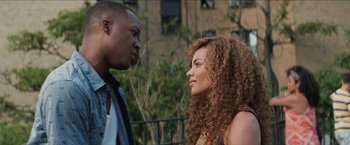Movie still from “In the Heights” (2021), directed by Jon M. Chu – A man and a woman talking to each other; Close Up shot, Over the shoulder angle