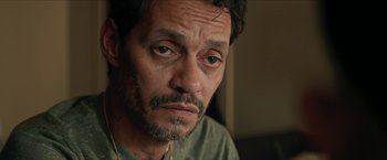 Movie still from “In the Heights” (2021), directed by Jon M. Chu – A person looking at the camera; Close Up shot, High angle