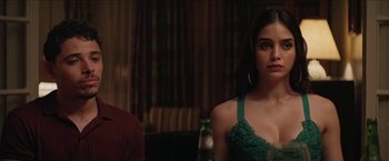 Movie still from “In the Heights” (2021), directed by Jon M. Chu – A woman in a green top sitting next to a man; Close Up shot, Over the shoulder angle