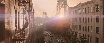 Movie still from “In the Heights” (2021), directed by Jon M. Chu – A view of a bridge and a city street from above; Extreme Wide shot, High angle