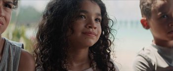 Movie still from “In the Heights” (2021), directed by Jon M. Chu – A young girl's face with long hair; Close Up shot, Low angle