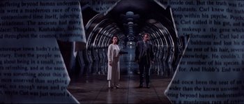 Movie still from “In the Mouth of Madness” (1994), directed by John Carpenter – A man and a woman standing in an underground tunnel; Wide shot, Low angle