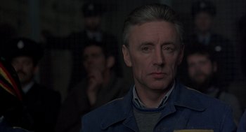 Movie still from “In the Name of the Father” (1993), directed by Jim Sheridan – A person wearing a jacket; Close Up shot, Over the shoulder angle