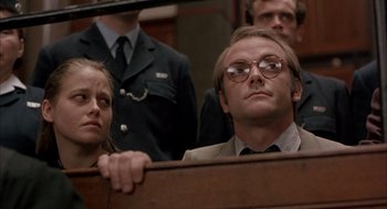 Movie still from “In the Name of the Father” (1993), directed by Jim Sheridan – A man and a woman in a court room; Close Up shot, Low angle