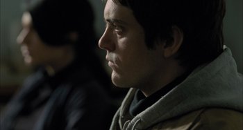 Movie still from “Incendies” (2010), directed by Denis Villeneuve – A person looking to his left; Close Up shot, Over the shoulder angle