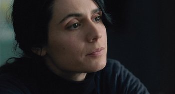 Movie still from “Incendies” (2010), directed by Denis Villeneuve – A person looking at the camera; Close Up shot, High angle