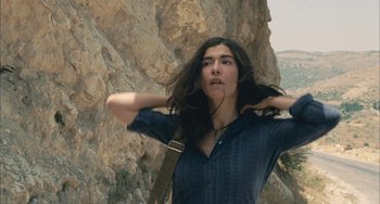 Movie still from “Incendies” (2010), directed by Denis Villeneuve – A woman with her hands behind her head; Close Up shot, Low angle