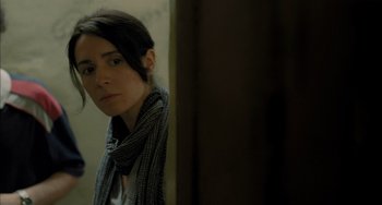 Movie still from “Incendies” (2010), directed by Denis Villeneuve – A woman with a scarf looking into a mirror; Close Up shot, Over the shoulder angle