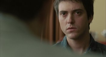 Movie still from “Incendies” (2010), directed by Denis Villeneuve – A person looking at the camera; Close Up shot, Over the shoulder angle