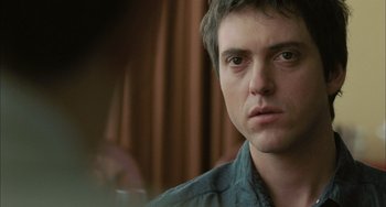 Movie still from “Incendies” (2010), directed by Denis Villeneuve – A person looking at the camera; Close Up shot, Over the shoulder angle