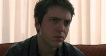 Movie still from “Incendies” (2010), directed by Denis Villeneuve – A person with short brown hair; Close Up shot, Low angle