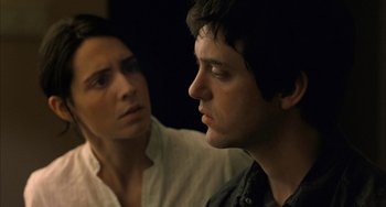 Movie still from “Incendies” (2010), directed by Denis Villeneuve – A man and a woman looking at one another; Close Up shot, Over the shoulder angle