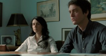 Movie still from “Incendies” (2010), directed by Denis Villeneuve – A man and a woman sitting in front of a table; Medium shot, Over the shoulder angle
