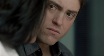 Movie still from “Incendies” (2010), directed by Denis Villeneuve – A person with long black hair; Close Up shot, Over the shoulder angle