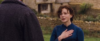 Movie still from “Far from the Madding Crowd” (2015), directed by Thomas Vinterberg – A woman with her hand over her heart; Close Up shot, Over the shoulder angle