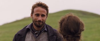 Movie still from “Far from the Madding Crowd” (2015), directed by Thomas Vinterberg – A man with a beard is talking to a woman; Close Up shot, Over the shoulder angle