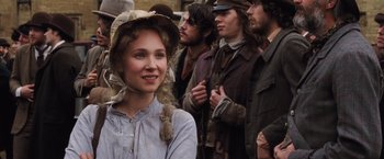 Movie still from “Far from the Madding Crowd” (2015), directed by Thomas Vinterberg – A group of people standing next to each other wearing hats; Close Up shot, Over the shoulder angle