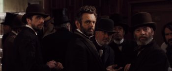 Movie still from “Far from the Madding Crowd” (2015), directed by Thomas Vinterberg – A group of men standing next to each other wearing hats; Close Up shot, Over the shoulder angle