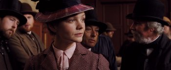 Movie still from “Far from the Madding Crowd” (2015), directed by Thomas Vinterberg – A woman wearing a hat and a suit; Close Up shot, Low angle